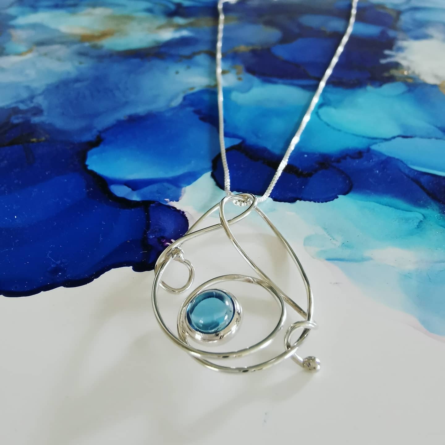 Silver Ocean Swirl Necklace with Swiss Blue Topaz